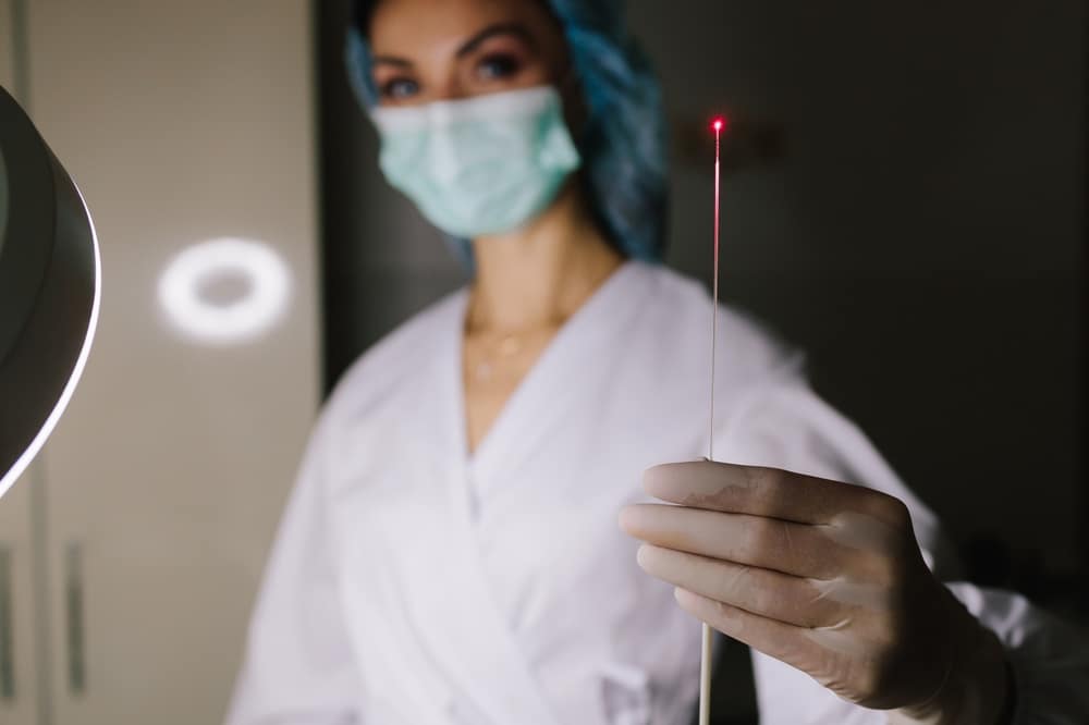 Provider holding up a thermal ablation tool used for thermal vein treatment. Provider holding up a thermal ablation tool used for thermal vein treatment.